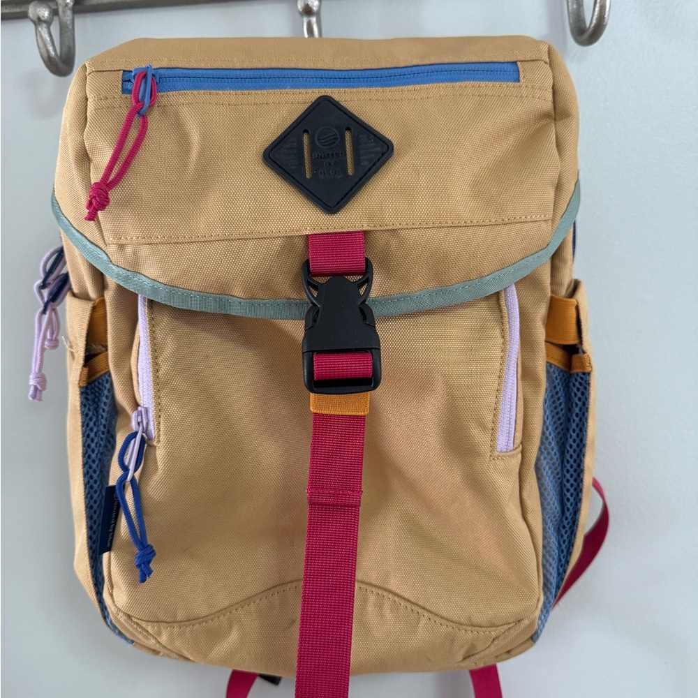 United By Blue Tan Backpack with Red and Blue Details